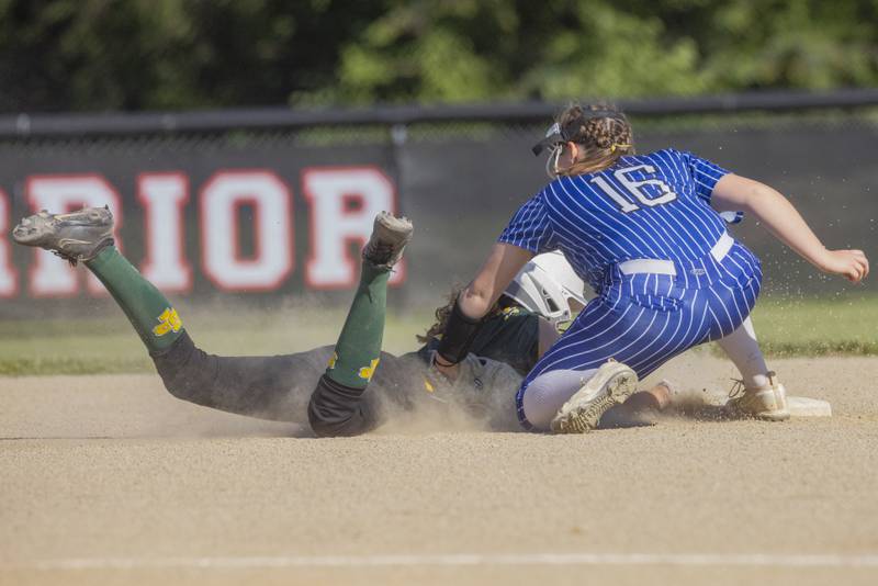 Newark's Dottie Wood attempts  to tag out Grant Park's Claire Sluis in a close play during the Class 1A Sectional Semifinal game at Woodland High School on May 22, 2024.