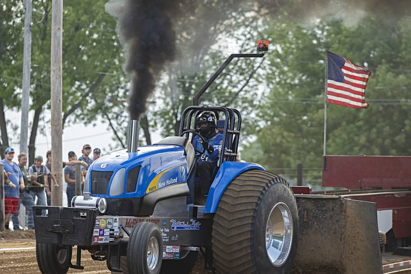 Mark Wyttenbach hammers the throttle in the Badger State Tractor Pullers light limited super stock class Wednesday, August 9, 2023 at the Carroll County fair.