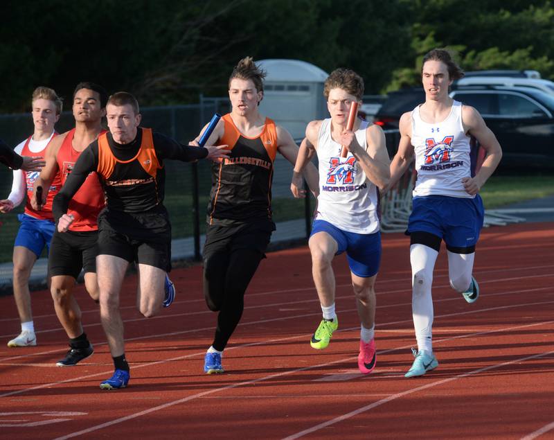 Morrison's Camden Pruis hands the baton to Levi Mulder as they race against Milledgeville's Konner Johnson and Kole Hauptman in the first exchange of the 4x100 at the Ed Schmidt Invitational Track Meet at Erie High School on Friday, April 19, 2024.