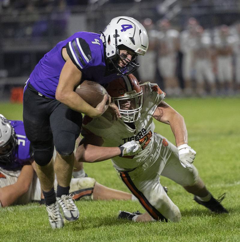 Dixon’s Landon Knigge fights off a Byron tackler Friday, Oct. 18, 2024, at A.C. Bowers Field in Dixon.