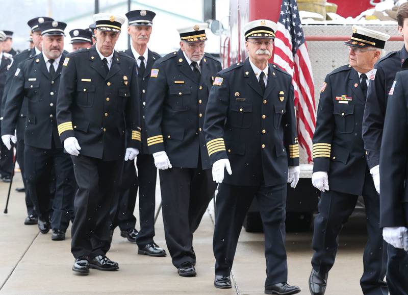 Active and retired Sycamore firefighters file in Saturday, Jan. 6, 2024, during the visitation for Sycamore firefighter/paramedic Bradley Belanger at the Sycamore Park District Community Center. Belanger, 44, who worked with the Sycamore Fire Department for more than two decades, died Friday, Dec. 22, after a yearlong battle with cancer.