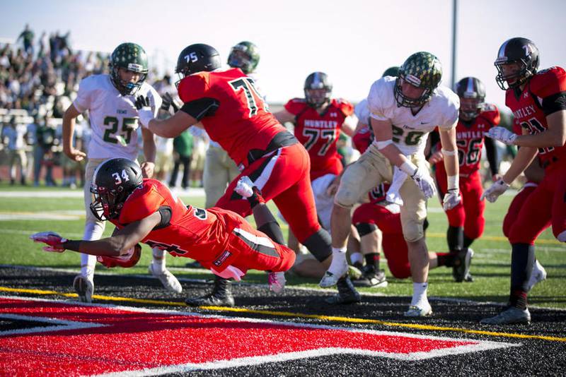 Huntley running back Carter Beaudette dives into the end zone on a 3-yard touchdown run in the third quarter of a Class 8A second-round playoff game against Fremd on Saturday, Nov. 5, 2016, in Huntley. Huntley won, 38-30.