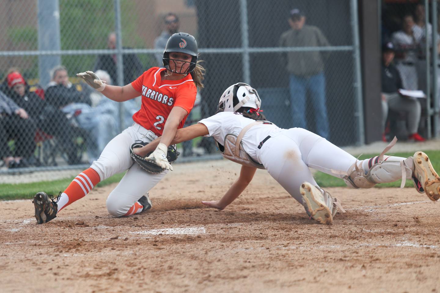 Lincoln-Way Central’s Lucy Cameron tags out Lincoln-Way West’s Reese Rourke as she attempts to score on Tuesday, May 14, 2024 in New Lenox.