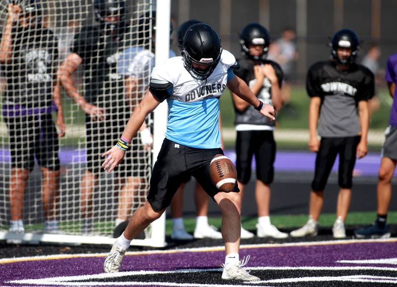 Downers Grove North’s Charlie Cruse punts the ball during a practice on Tuesday, Aug. 20, 2024 at the school.