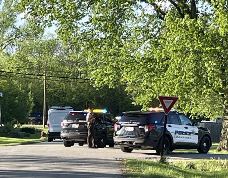 A Will County sheriff's deputy guards the intersection of Rickerman Road and 145th Place in the Lockport Heights neighborhood the evening of Tuesday. May 7, 2024.   Both Will County and Lockport police were at the scene.