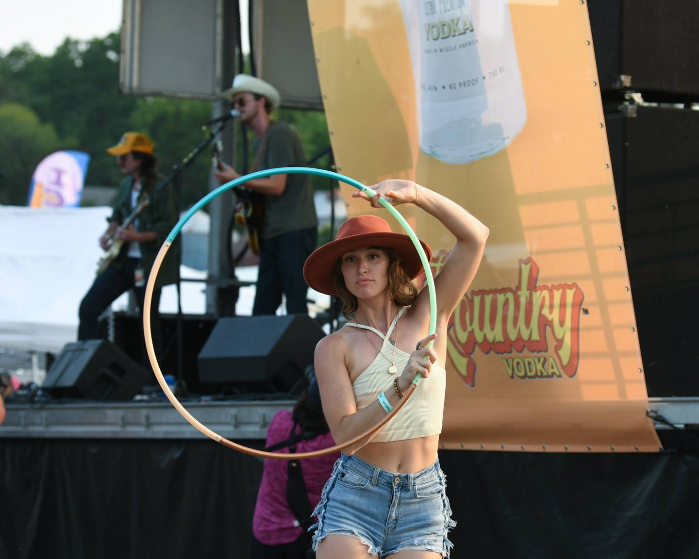 Teala Marie of Yorkville shows her skills with a hoop while the Miles Miller Band performs on Friday June 23, 2023 during the Summer Solstice Music Festival in downtown Yorkville.