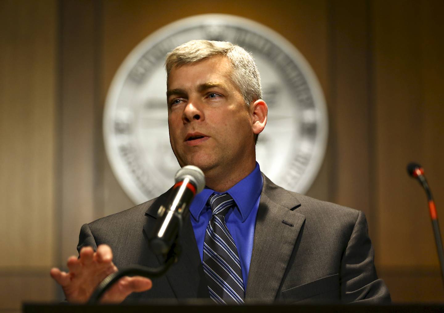 Mayor Bob O'Dekirk speaks to a packed council chamber after taking the mayoral oath of office at Joliet City Hall on Monday, May 4, in Joliet, Ill.