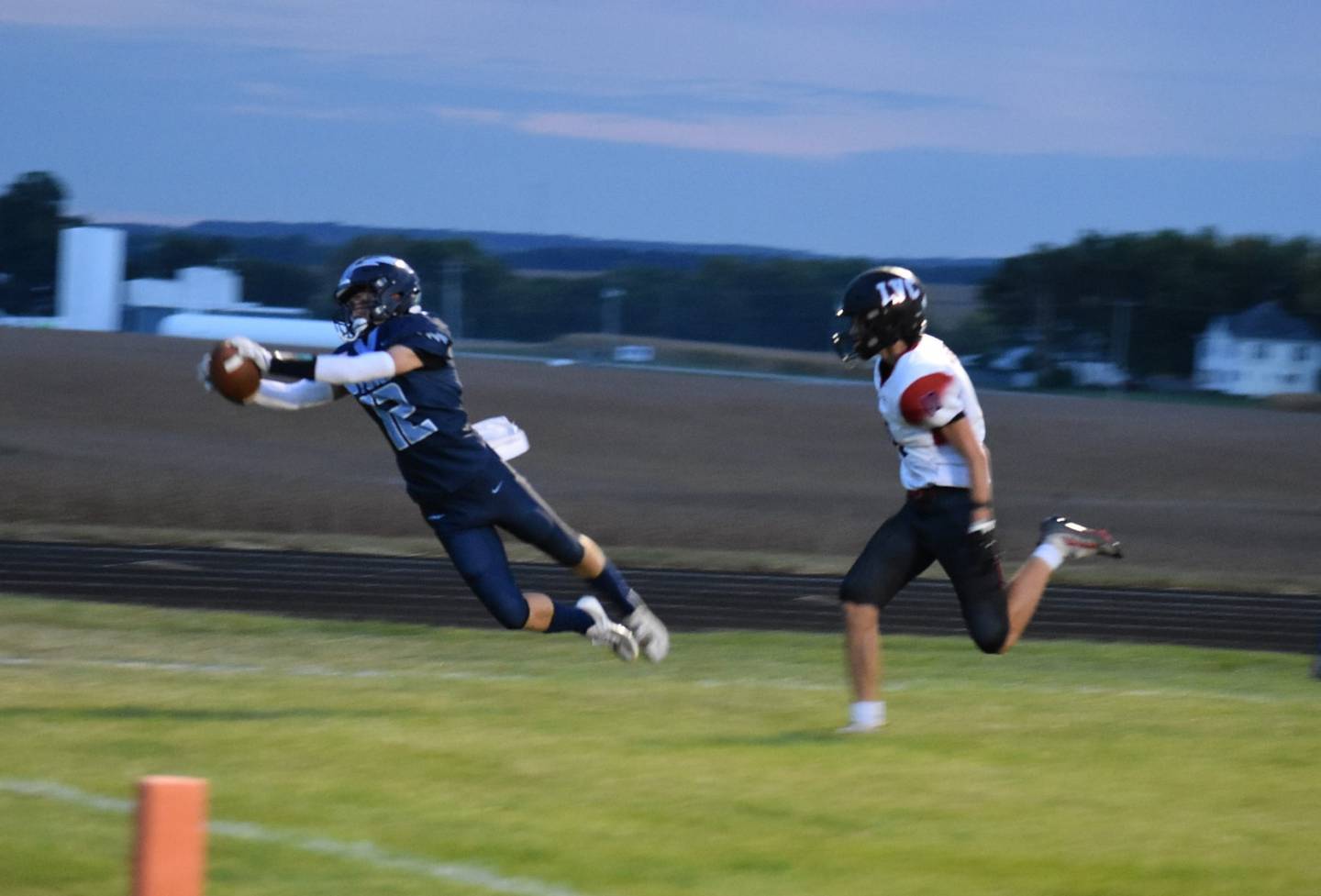 Bureau Valley's Brandon Carrington makes a diving catch for a Storm touchdown in the first quarter of Friday's game at Storm Stadium. The Storm beat Lewiston-Valley-Cuba 46-16