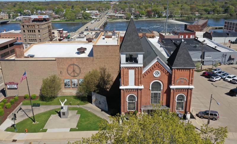 An aerial view of the First Baptist Church on Wednesday, May 3, 2023 in Dixon. Beyond is the current Galena Avenue Bridge, approximately where the Truesdell Bridge was before its collapse on May 4, 1873, and the northern shore from where the Rev. J.H. Pratt entered the water to conduct baptisms in the Rock River.