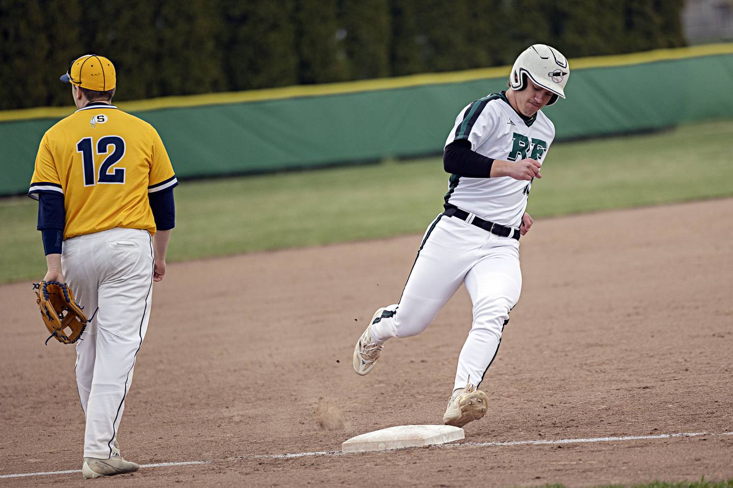 Rock Falls’ Carter Schueler rounds third and heads for home on a double by teammate Hunter Gale against Sterling Friday, March 29, 2024 at Rock Falls High School.