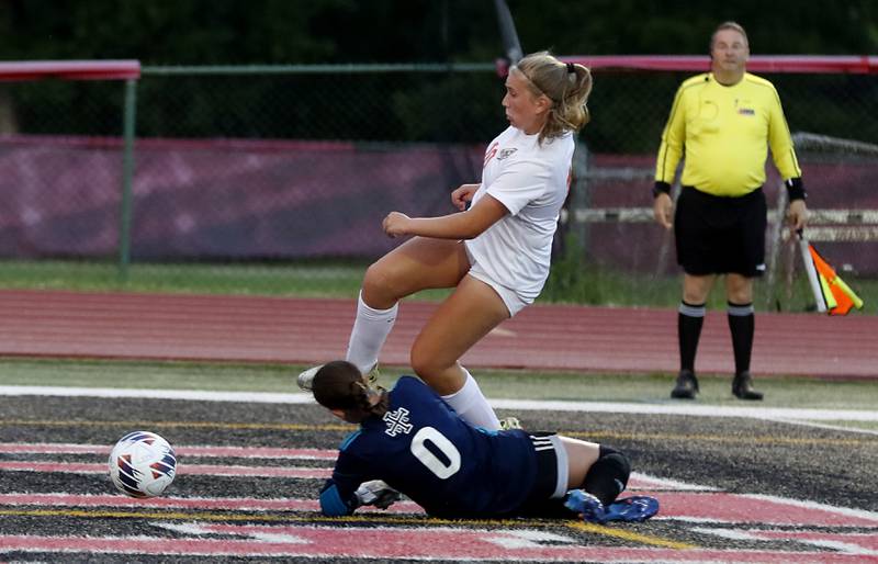 St. Ignatius College Prep's MC Galante goes after the ball as Crystal Lake Central's Brooklynn Carlson heads towards the deflected ball during the Class 2A Deerfield Supersectional girls soccer match on Tuesday, May 28, 2024, at Deerfield High School.
