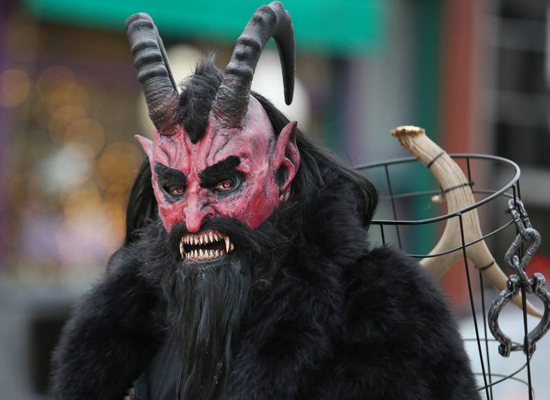 A Red Krampus character walks in the 5th annual Halloween Parade on Saturday, Oct. 28, 2023 downtown Princeton.