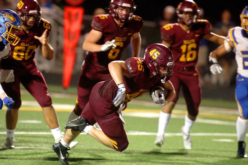 Richmond-Burton’s Riley Shea lunges for the end zone on a touchdown run against Johnsburg in varsity football action on Friday, Sept. 13, 2024, at Richmond-Burton High School in Richmond.