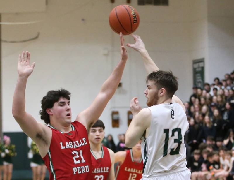 St. Bede's Mason Ross passes the ball around L-P's Josh Senica on Wednesday, Feb. 14, 2024 at St. Bede Academy.