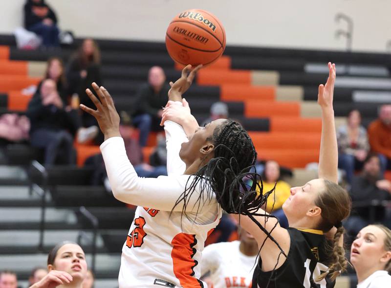 DeKalb’s Cayla Evans is fouled by Metea Valley's Kelly Clish during their game Friday, Jan. 19, 2024, at DeKalb High School.