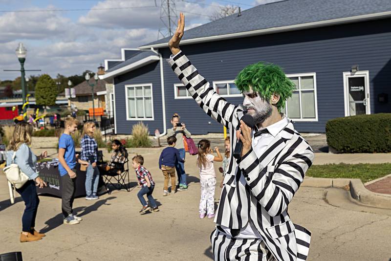 Matt Griffo, channeling the iconic Beetlejuice, leads a group in a sing and dace Saturday, Oct. 21, 2023 at Dixon’s Scarecrow Fest.