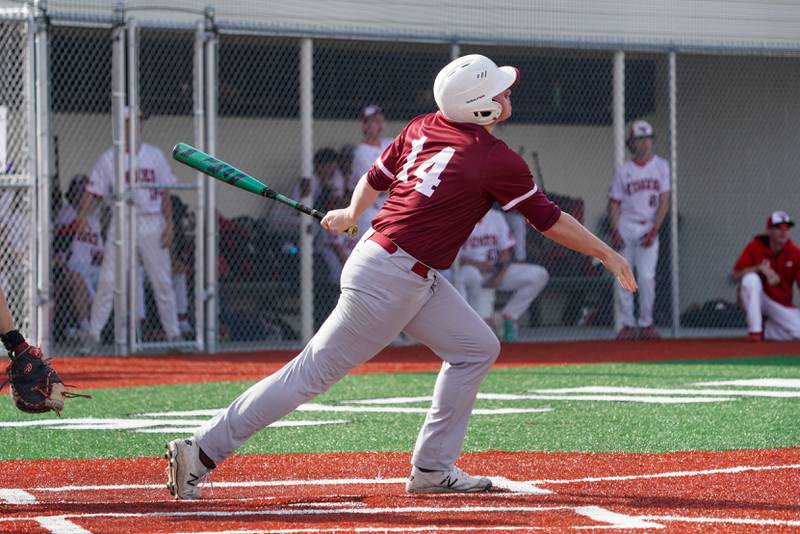 Plainfield North's Kyle Darlington (14) hits an RBI single against Yorkville during a baseball game at Yorkville High School in Yorkville on Thursday, May 16, 2024.