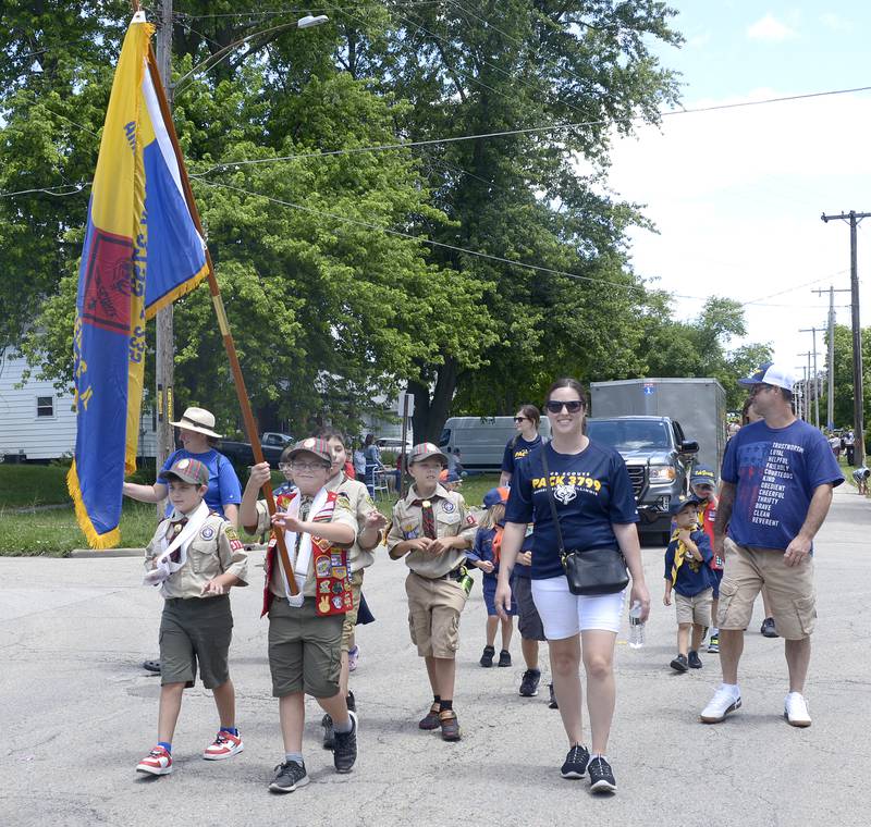 Marseilles Boy Scout Troop 3799 carries the flag as they march Sunday  in the Marseilles Fun Days Parade.