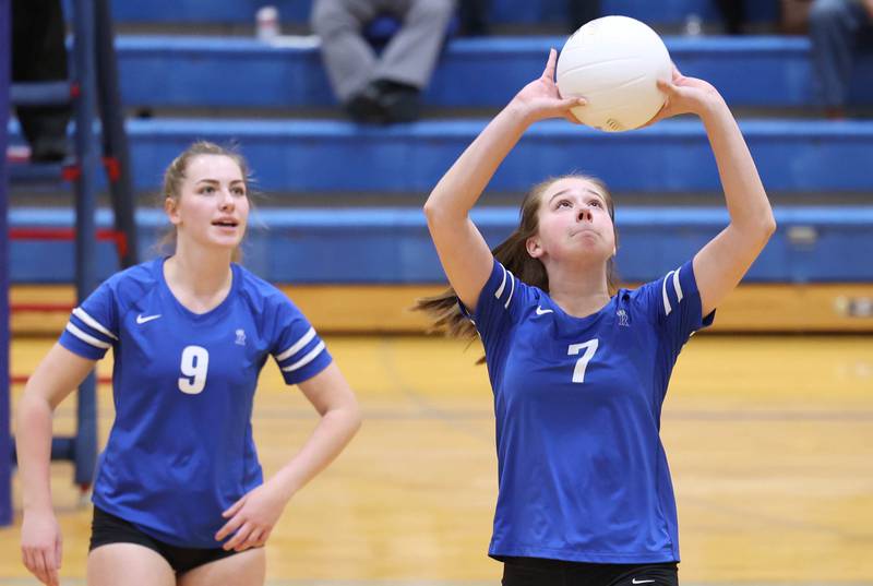 Rosary's Molly Lambert sets the ball during their Regional semifinal match against Genoa-Kingston Tuesday, Oct. 25, 2022, at Rosary High School in Aurora