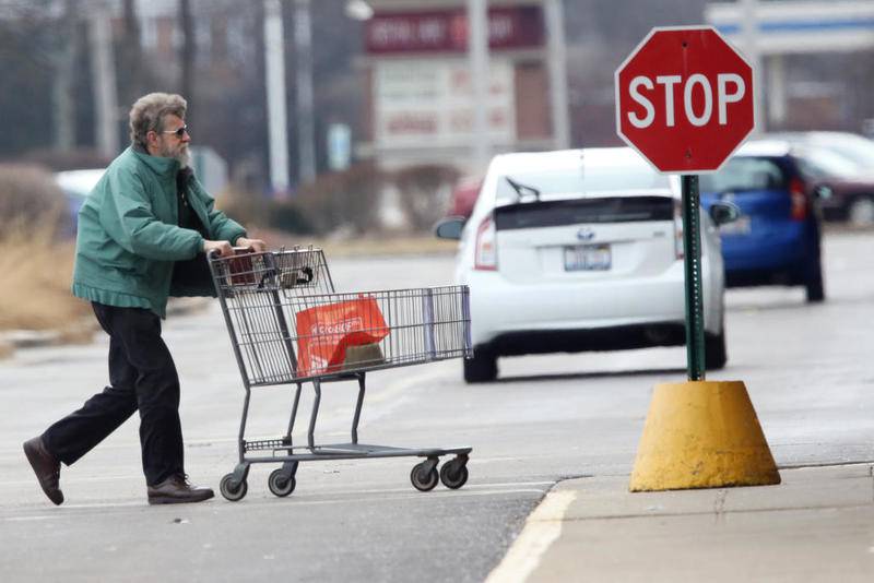 A shopper heads into Joseph's Marketplace on Thursday in Crystal Lake. The grocery store, which opened on 2005, closed Friday.