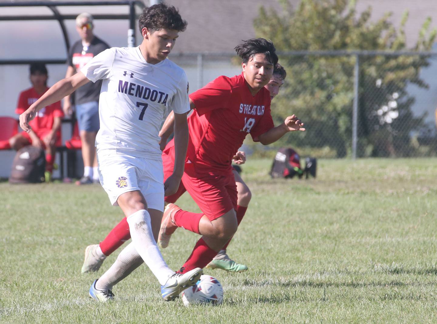 Mendota's Isaac Diaz kicks the ball ahead of Streator's Landon Muhlstadt on Saturday, Aug. 31, 2024 at James Street Recreation Area in Streator.