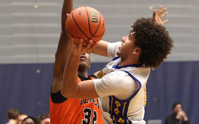 Warren's Alex Daniels shoots over DeKalb’s Justin O’Neal Tuesday, Feb. 27, 2024, during their Class 4A sectional semifinal game at Rock Valley College in Rockford.