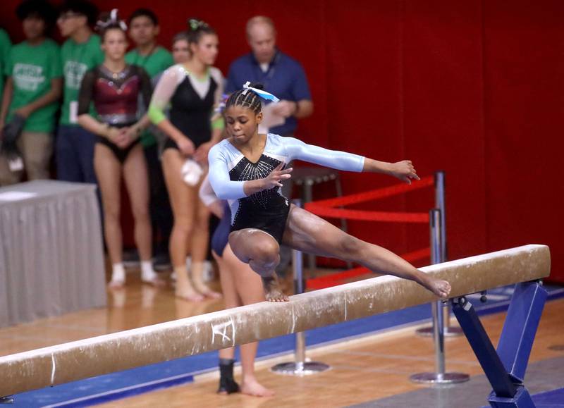 Willowbrook’s Naomi Campbell competes on the balance beam during the IHSA Girls State Gymnastics Meet at Palatine High School on Friday, Feb. 16, 2024.