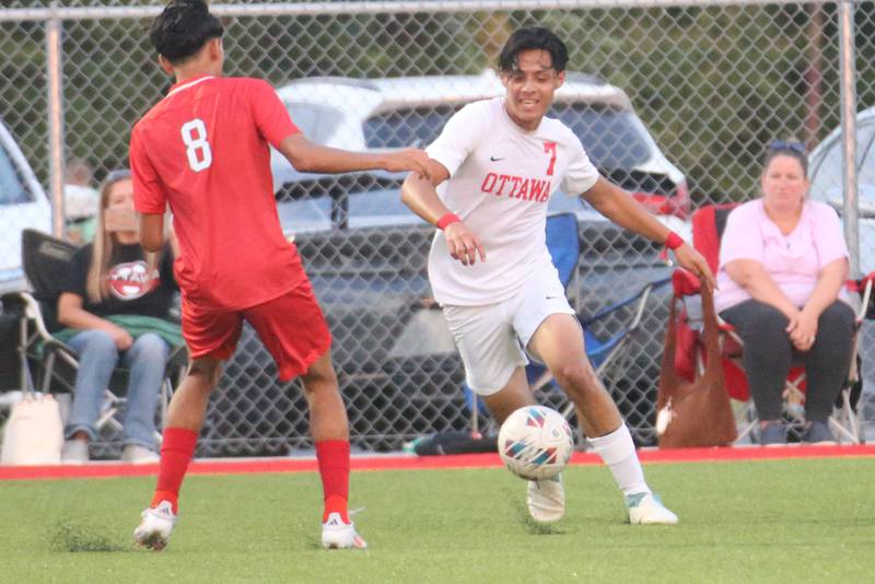 Ottawa's Jorge Lopez pushes the ball around L-P's Emilio Nanez on Wednesday, Sept. 18, 2024 at the L-P Athletic Complex in La Salle.