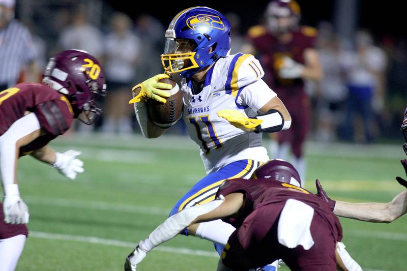 Johnsburg’s Ryan Franze runs the ball in varsity football action on Friday, Sept. 13, 2024, at Richmond-Burton High School in Richmond.