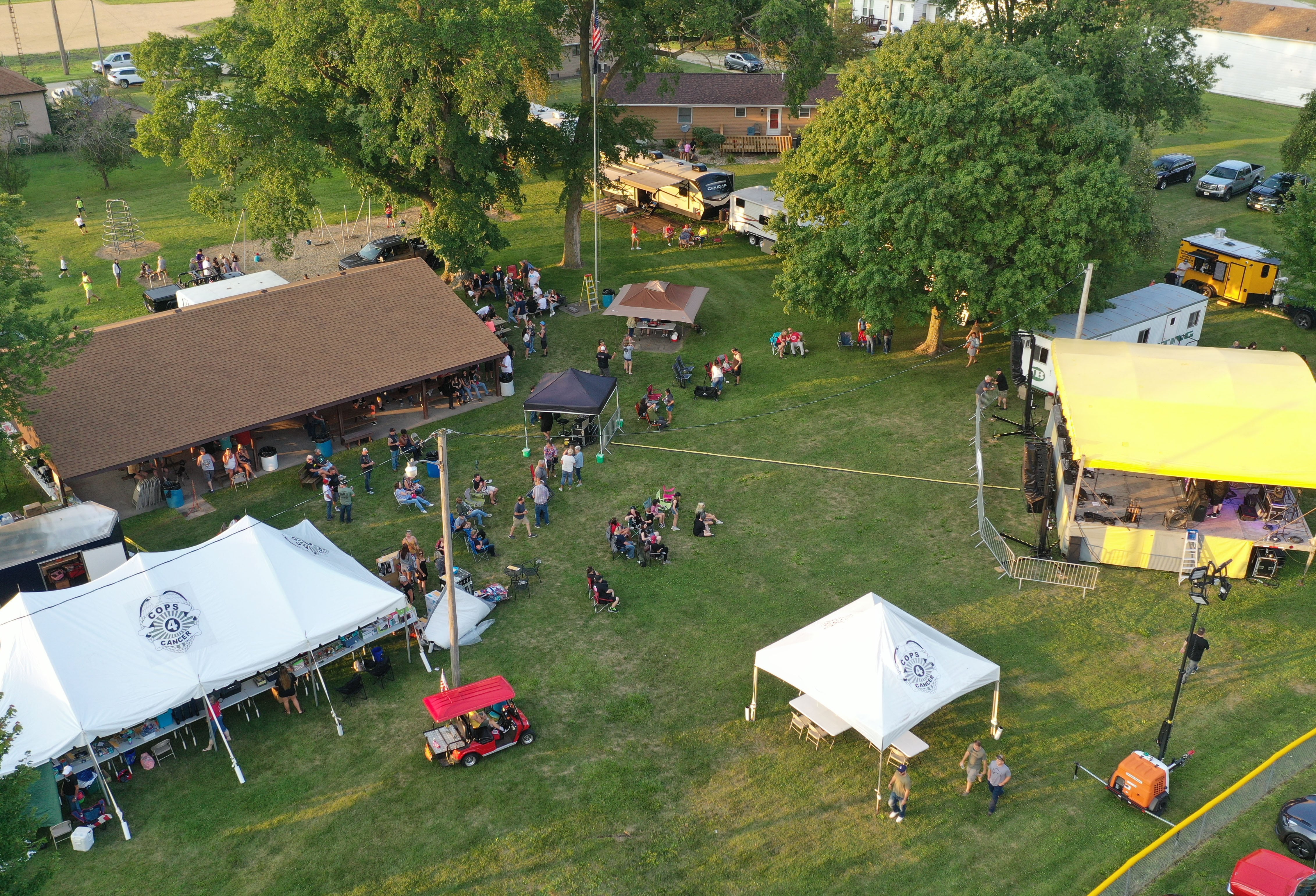 People attend the Cops 4 Cancer fundraiser on Friday, July 26, 2024 at Cerri Memorial Park in Cedar Point. Cops 4 Cancer began in 2003. The group helps families in their fight against cancer, by providing financial assistance in a variety of ways.