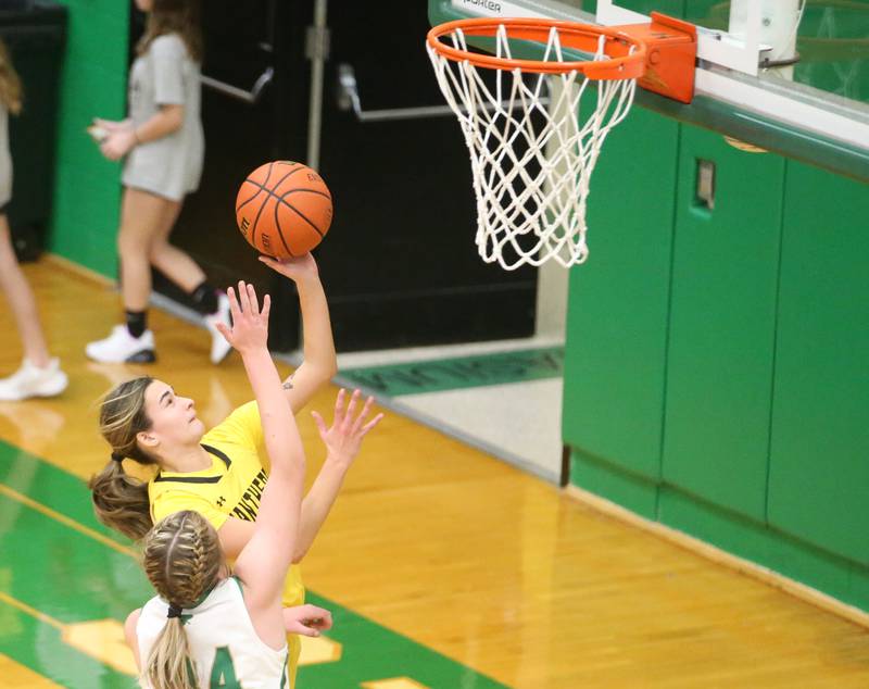 Putnam County's Ava Hatton drives to the basket as Seneca's Tessa Krull defends on Thursday, Jan. 4, 2024 at Seneca High School.