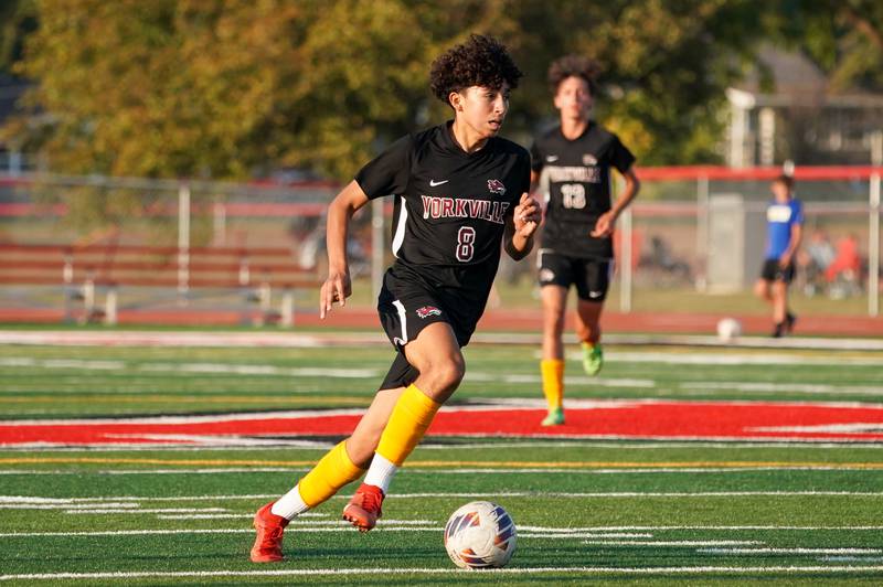 Yorkville's Oliver Villa (8) moves the ball up the midfield against Oswego during a soccer match at Yorkville High School on Tuesday, Sep 17, 2024.