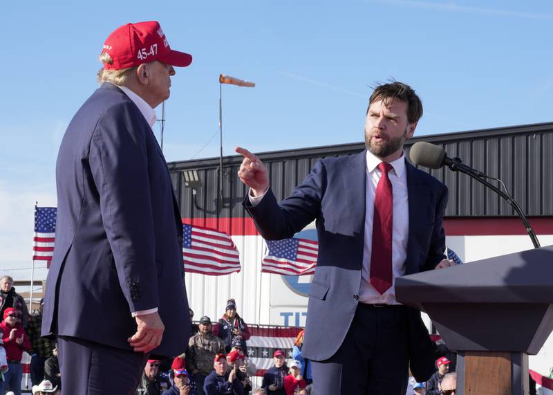 FILE - Sen. J.D. Vance, R-Ohio, right, points toward Republican presidential candidate former President Donald Trump at a campaign rally, March 16, 2024, in Vandalia, Ohio. (AP Photo/Jeff Dean, File)