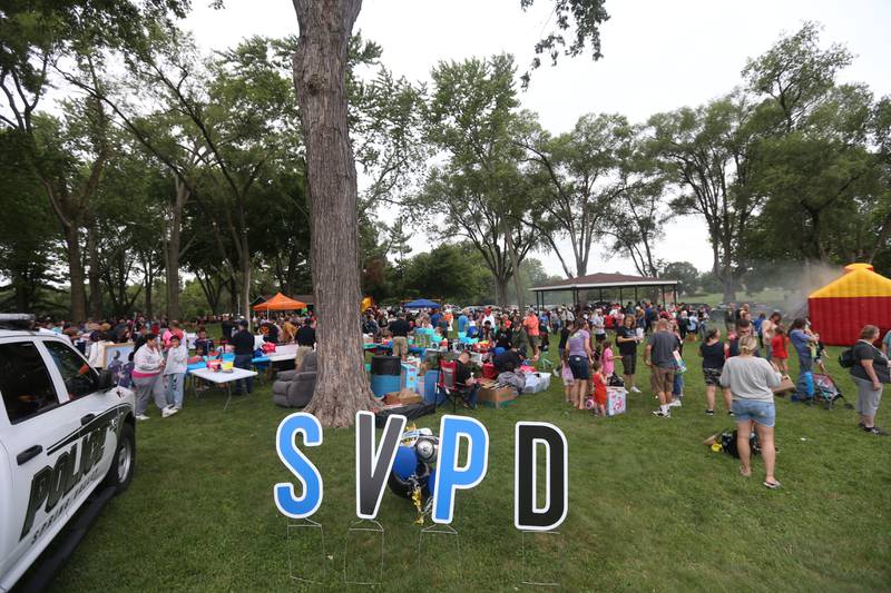 A large crowd attends the National Night Out event on Tuesday, Aug. 6, 2024 at Kirby Park in Spring Valley.