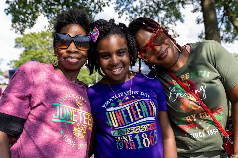 Boilingbrook resident Anira Coleman has fun with her grandmother Kimberly Harvey (Left) and her mother Ashley Harvey (Right) during Lockport Township Park District's Juneteenth Celebration at A.F. Hill Park on June 19, 2024.