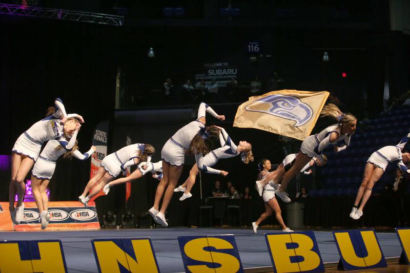 Members of the Johnsburg cheer team perform during the IHSA Cheer State Finals in Grossinger Motors Arena on Saturday, Feb. 4, 2023 in Bloomington.