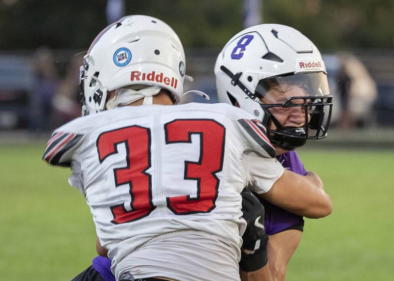 Dixon’s Tyson Dambman gets hit hard by Stillman Valley’s Michael Orlando Friday, Aug. 30, 2024 at Dixon High School.