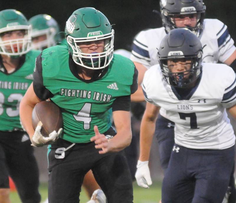 Seneca's Nick Grant runs past Lisle's Jayden Bae at Seneca on Friday, Sept. 6, 2024.