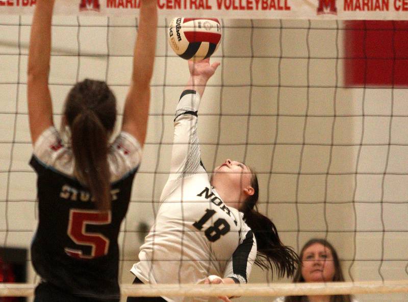 Grayslake North’s Macie Ahmer sends the ball over the net against Marian Central in girls volleyball in Woodstock Monday.