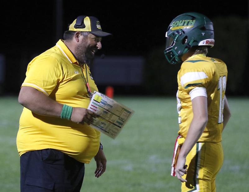 Crystal Lake South Head Coach Rob Fontana  takes with quarterback Aidan Neyt during a Fox Valley Conference football game on Prairie Ridge Friday, Sept. 6, 2024, at Crystal Lake South High School.