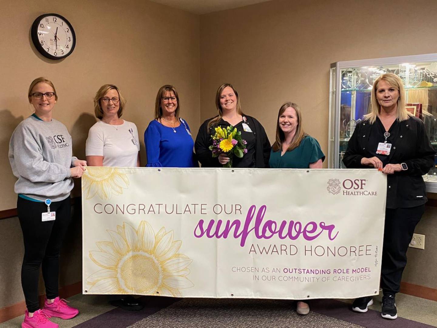 Kaylynn McNamee, CMA and 2024 Sunflower Award winner is pictured with OSF Saint Luke and OSF Medical Group leaders.