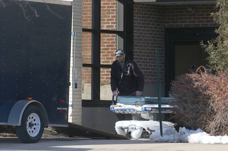 A worker removes a hospital bed from the former St. Margarets Hospital (IVCH) building on Wednesday, Feb. 1, 2023 in Peru.