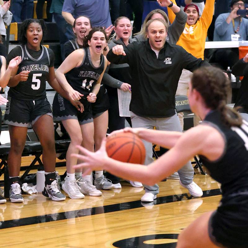 The Kaneland bench celebrates as Kaneland's Emily Kunzer grabs the loose ball to seal the win over Sycamore in their Class 3A sectional semifinal Tuesday, Feb. 20, 2024, at Sycamore High School.