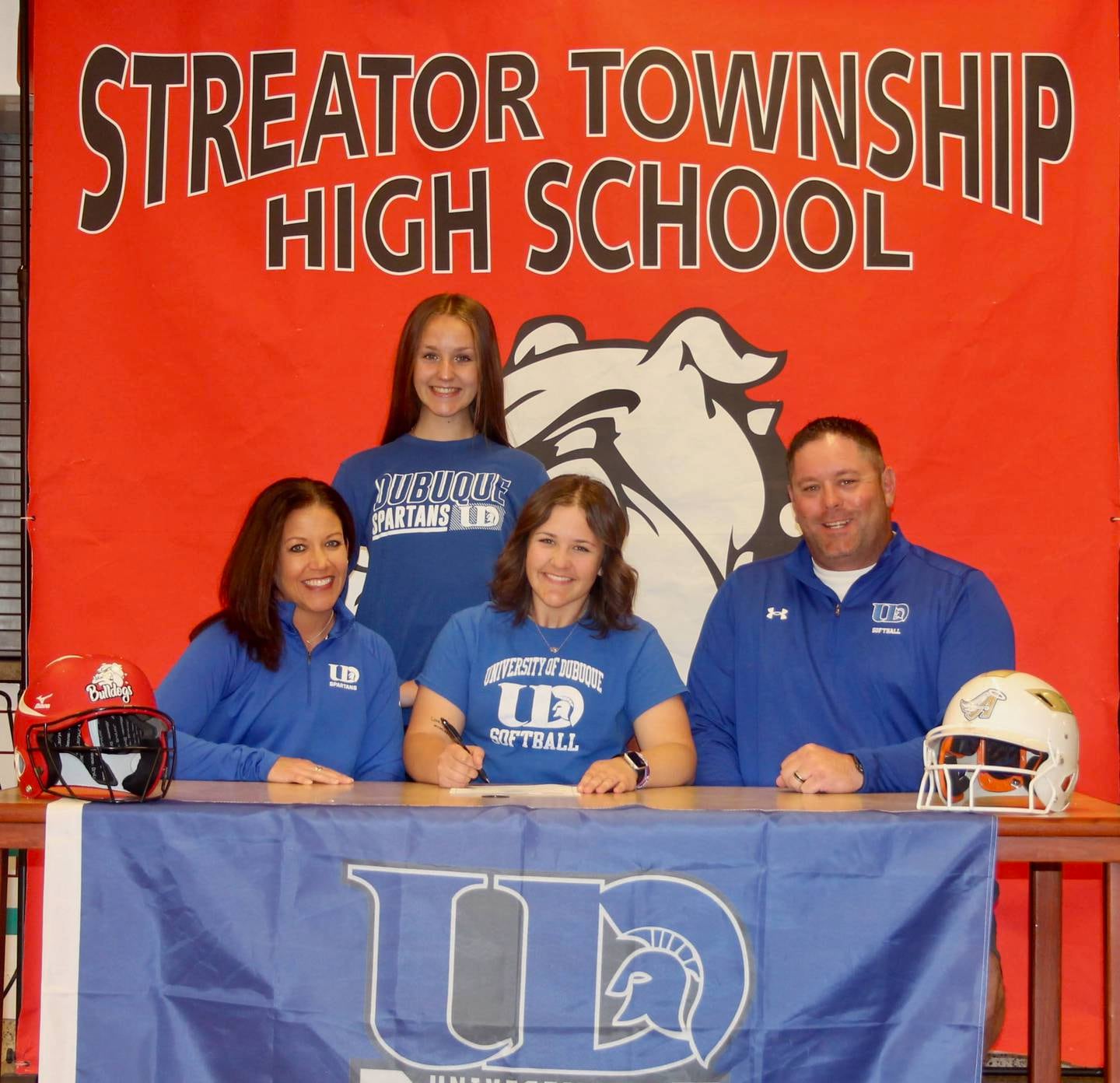 Recent Streator High School graduate Jaelyn Blakemore has committed to continue her academic career at the University of Dubuque and her softball career at the NCAA Division III level with the Spartans. Pictured here is Blakemore alongside her parents, Jessica and Matt Blakemore, and her sister, Payton.