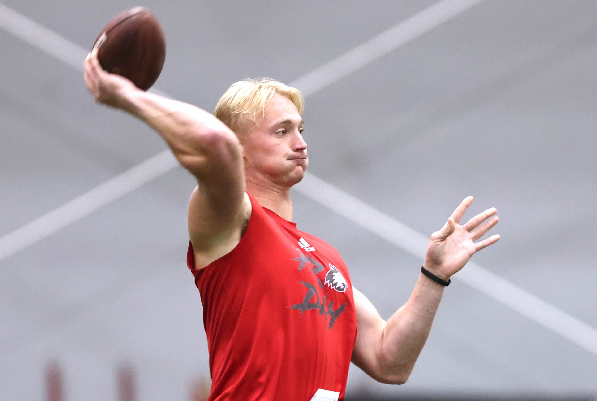 Former Northern Illinois quarterback Rocky Lombardi throws a pass Thursday, March 7, 2024, during pro day in the Chessick Practice Center at NIU. Former NIU players got a chance to show their stuff in front of NFL scouts who attended Thursday.