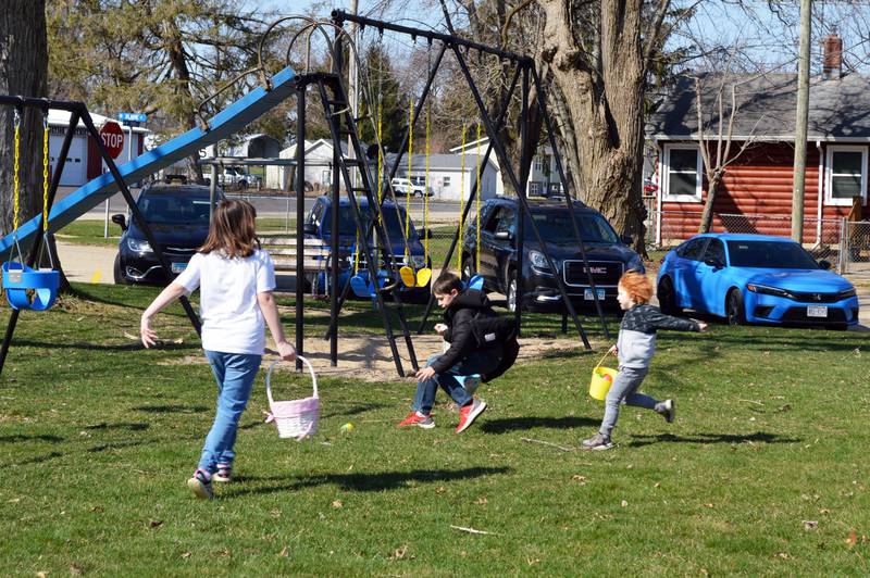 Leroy Freitag (center), 9, of Evansville, Wisconsin, beats Lily Pratt (left), 9, of Leaf River, left, and Ivan Schumakar (right), 3, of Leaf River, right, to claim one of the final Easter eggs strewn in the park outside the Bertolet Building on April 8, 2023. The Leaf River Lions Club hosted a Breakfast with Bunny and the Easter egg hunt.