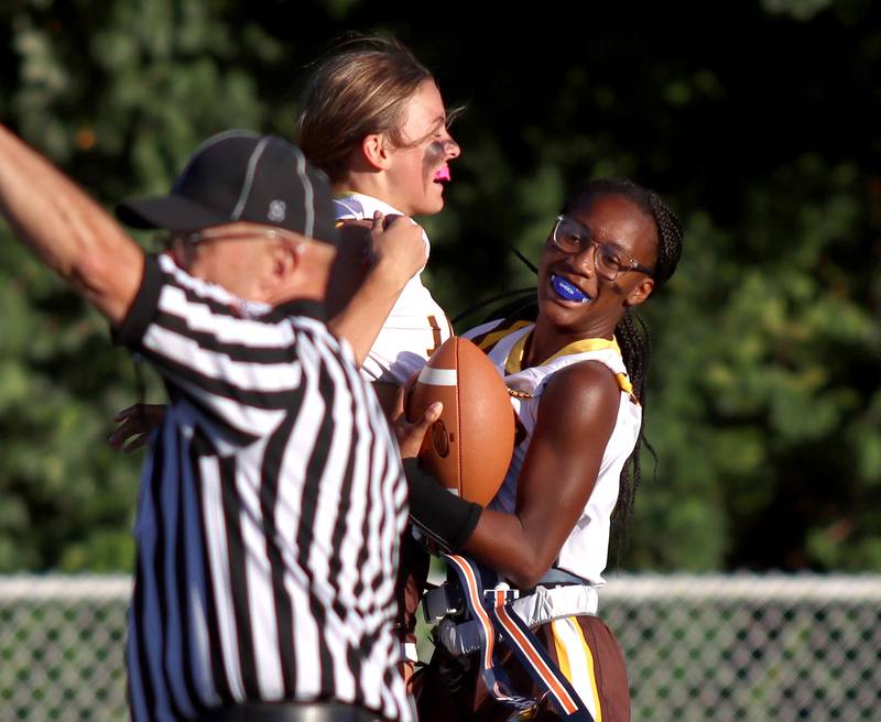 Jacobs’ Aaliyah Guichon, right, celebrates her touchdown in varsity flag football on Tuesday, Sept. 3, 2024, at Dundee-Crown High School in Carpentersville.