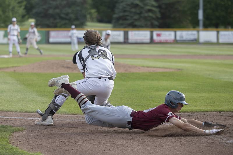 Morris’ Caston Norris comes in to score the second run against Sycamore Monday, June 3, 2024 in the Class 3A Geneseo supersectional.