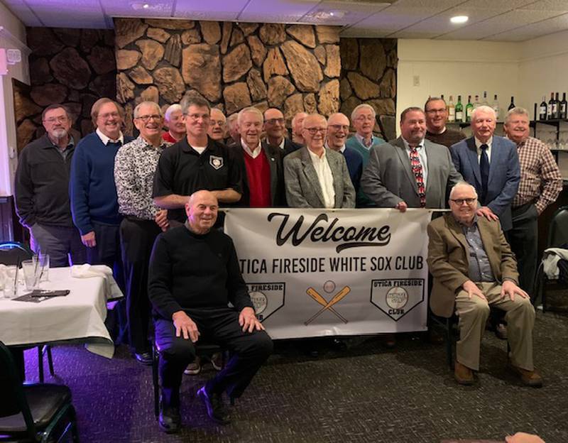 Members of the Utica Fireside White Sox Club pose for a photo at their annual Christmas banquet and auction. The group has raised more than $60,000 for local charities.