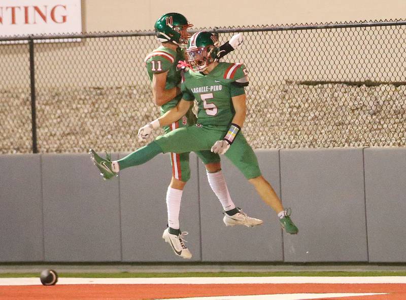 L-P's Brevyn Vogel celebrates in the end zone with teammate Reece Milus after scoring a touchdown against Ottawa on Friday, Sept. 13, 2024 at Howard Fellows Stadium.